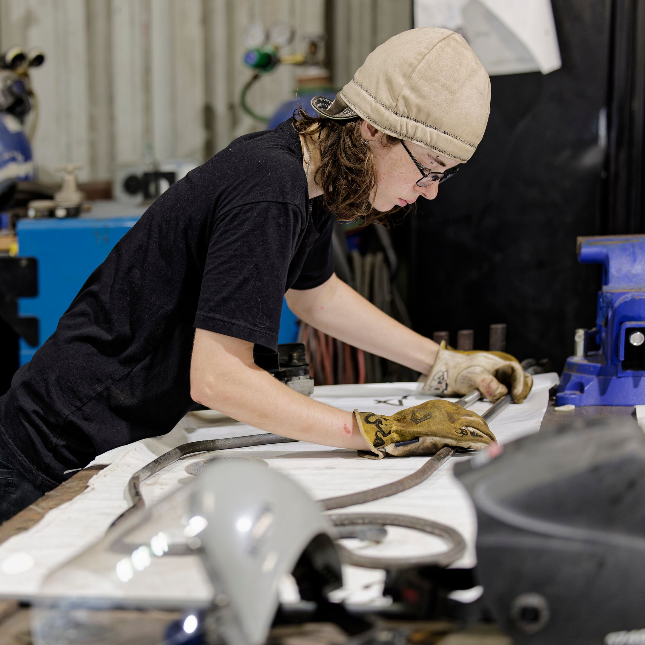 Skilled craftsman at Renfrow+Co working on metal fabrication, highlighting the company's custom fabrication services