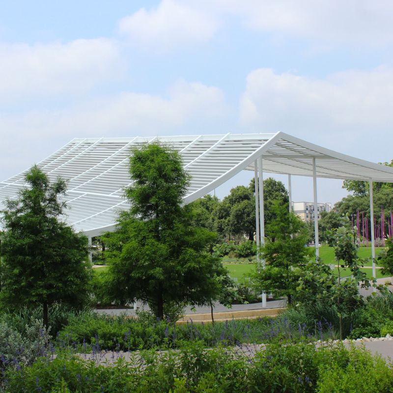 Modern white steel pavilion, custom-built by Renfrow+Co showcasing advanced architectural metal fabrication